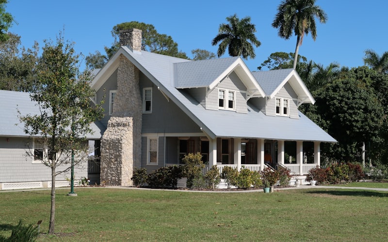 A Florida house exterior with palm trees